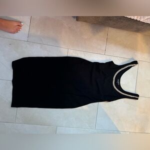 Black mini dress with chain neckline